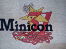 Minicon 31 t-shirt front: 'Minicon 31' with a star behind the '3', which has a tail that goes down into a big tangle below 'Minicon'